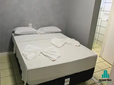 Uma cama ou camas num quarto em Estoril Praia de Iracema