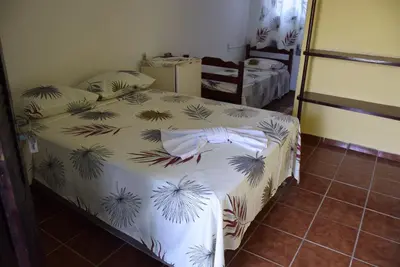 Uma cama ou camas num quarto em Pousada Panorama do Mar