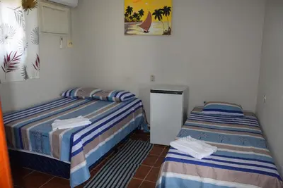 Uma cama ou camas num quarto em Pousada Panorama do Mar