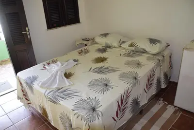 Uma cama ou camas num quarto em Pousada Panorama do Mar