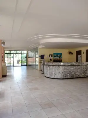 A área de receção ou átrio de Lindo apartamento próximo ao Beach Park