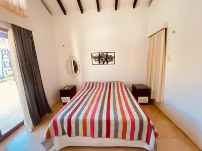 Uma cama ou camas num quarto em DUPLEX TAIBA BEACH RESORT