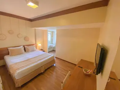 Uma cama ou camas num quarto em Magna Praia Hotel