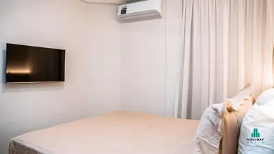 Uma cama ou camas num quarto em Condomínio Seixas | A 50m da Beira-Mar no Meireles