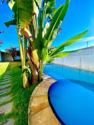 A piscina em ou perto de Casa 3 Quartos, 50 metros Da Praia