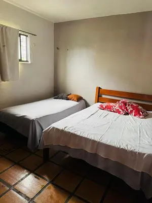 Uma cama ou camas num quarto em Casa 3 Quartos, 50 metros Da Praia