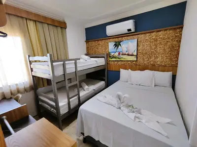 Uma cama ou camas num quarto em Belo apartamento projetado e vista total mar !