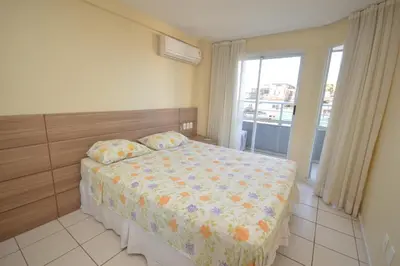 Uma cama ou camas num quarto em Praia Iracema Apartment