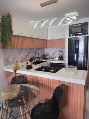 A cozinha ou kitchenette de Apartamento alto padrão moderno frente a praia com 2 quartos melhor localização beira mar