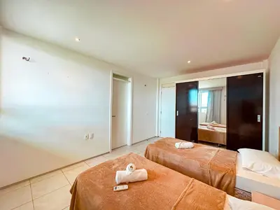 Uma cama ou camas num quarto em Porto das Dunas - Apê na Areia com Vista Espetacular, ideal para Famílias