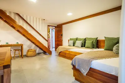 Uma cama ou camas num quarto em Arara House • Hospedagem Premium em Jeri