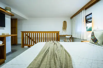 Uma cama ou camas num quarto em Arara House • Hospedagem Premium em Jeri