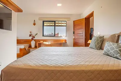 Uma cama ou camas num quarto em Arara House 2 • Charme e Tranquilidade