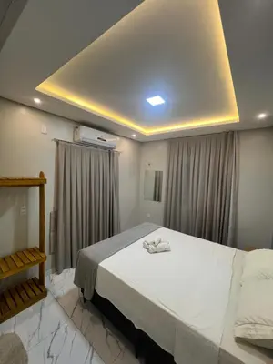 Uma cama ou camas num quarto em Apartamento Brisa Icaraizinho Villa brisa Icaraizinho