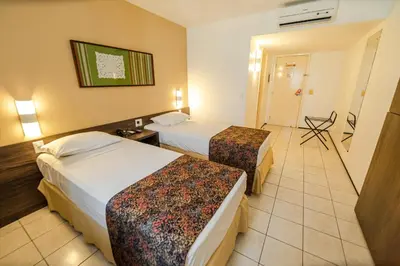 Uma cama ou camas num quarto em Hotel Sonata de Iracema