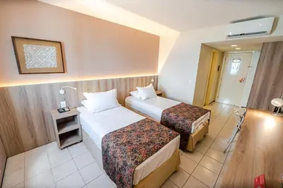 Uma cama ou camas num quarto em Hotel Sonata de Iracema