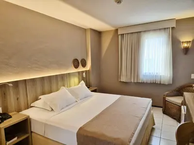 Uma cama ou camas num quarto em Hotel Sonata de Iracema
