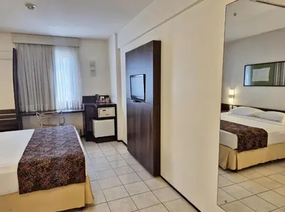 Uma cama ou camas num quarto em Hotel Sonata de Iracema