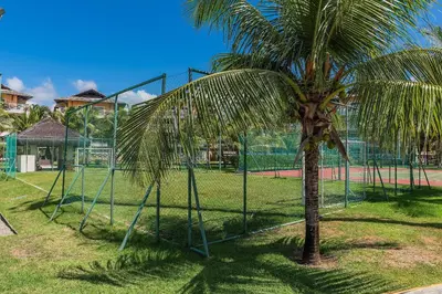 Um jardim no exterior de Portamaris Resort #201 - Beira mar por Carpediem