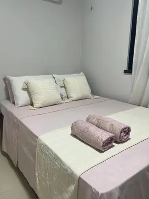 Uma cama ou camas num quarto em Casinha Azul Taiba