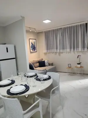 Uma área de estar em Flat Brasil tropical Belíssimo 905