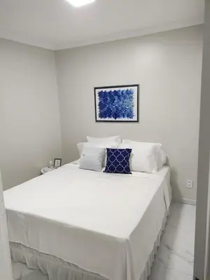 Uma cama ou camas num quarto em Flat Brasil tropical Belíssimo 905