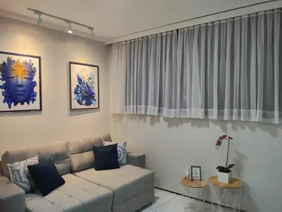 Uma área de estar em Flat Brasil tropical Belíssimo 905