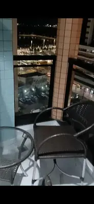 Uma área de estar em Flat Brasil tropical Belíssimo 905