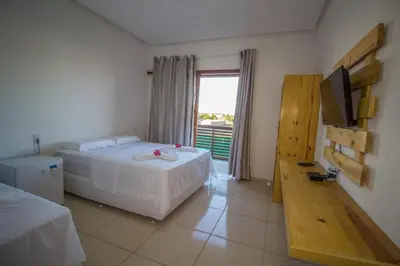 Uma cama ou camas num quarto em Villa Coco Beach Preá