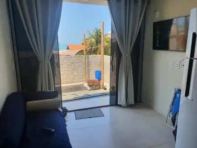 Uma televisão e/ou sistema de entretenimento em Casa de praia do Zeca
