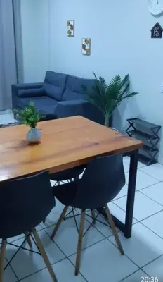 Uma área de estar em Apartamento Messejana 101
