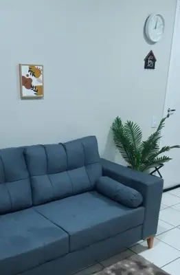 Uma área de estar em Apartamento Messejana 101
