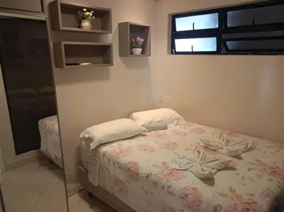 Uma cama ou camas num quarto em landscap Meireles Fortaleza