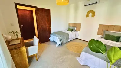 Uma cama ou camas num quarto em Lar Tropical
