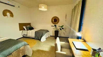Uma cama ou camas num quarto em Lar Tropical