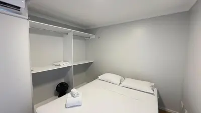 Uma cama ou camas num quarto em Iracema Residence Frente Mar by Escala Imóveis