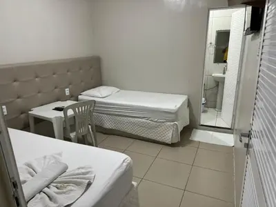 Uma cama ou camas num quarto em PRINCESA HOTEL Russas