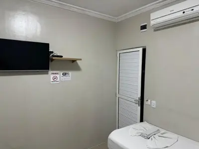 Uma televisão e/ou sistema de entretenimento em PRINCESA HOTEL Russas