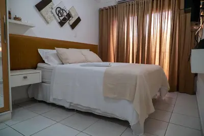 Uma cama ou camas num quarto em Paraíso à beira-mar: Beach Living by FTT