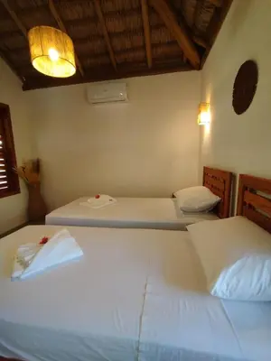 Uma cama ou camas num quarto em Casa da Lagoa - Icaraí Kite Village