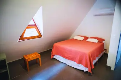 Uma cama ou camas num quarto em Pousada Café Brasil
