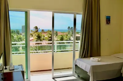 Uma cama ou camas num quarto em Hotel Villa Roma Beach Cumbuco