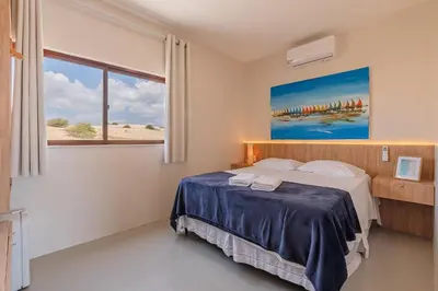 Uma cama ou camas num quarto em Casa Guerreiro - Elegância no Cumbuco by Carpediem