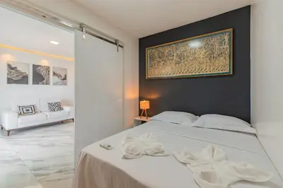 Uma cama ou camas num quarto em Iracema Residence - Apto em Meirelles by Carpediem