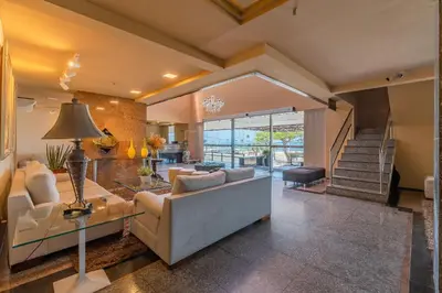 Uma área de estar em Iracema Residence - Apto em Meirelles by Carpediem