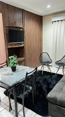 Uma área de estar em Flat Mobiliado na Beira Mar