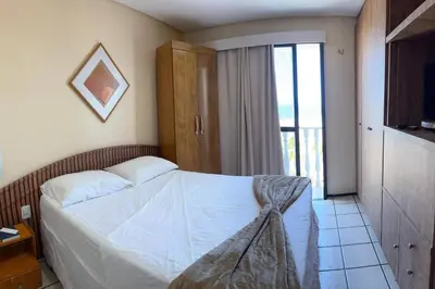 Uma cama ou camas num quarto em Flat Mobiliado na Beira Mar