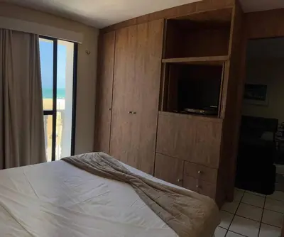 Uma cama ou camas num quarto em Flat Mobiliado na Beira Mar