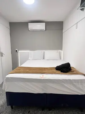 Uma cama ou camas num quarto em 204 Atlântico Residence