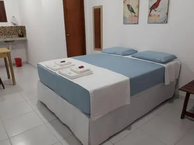 Uma cama ou camas num quarto em Studio Centro de Eventos Fortaleza 01 Giga WI FI